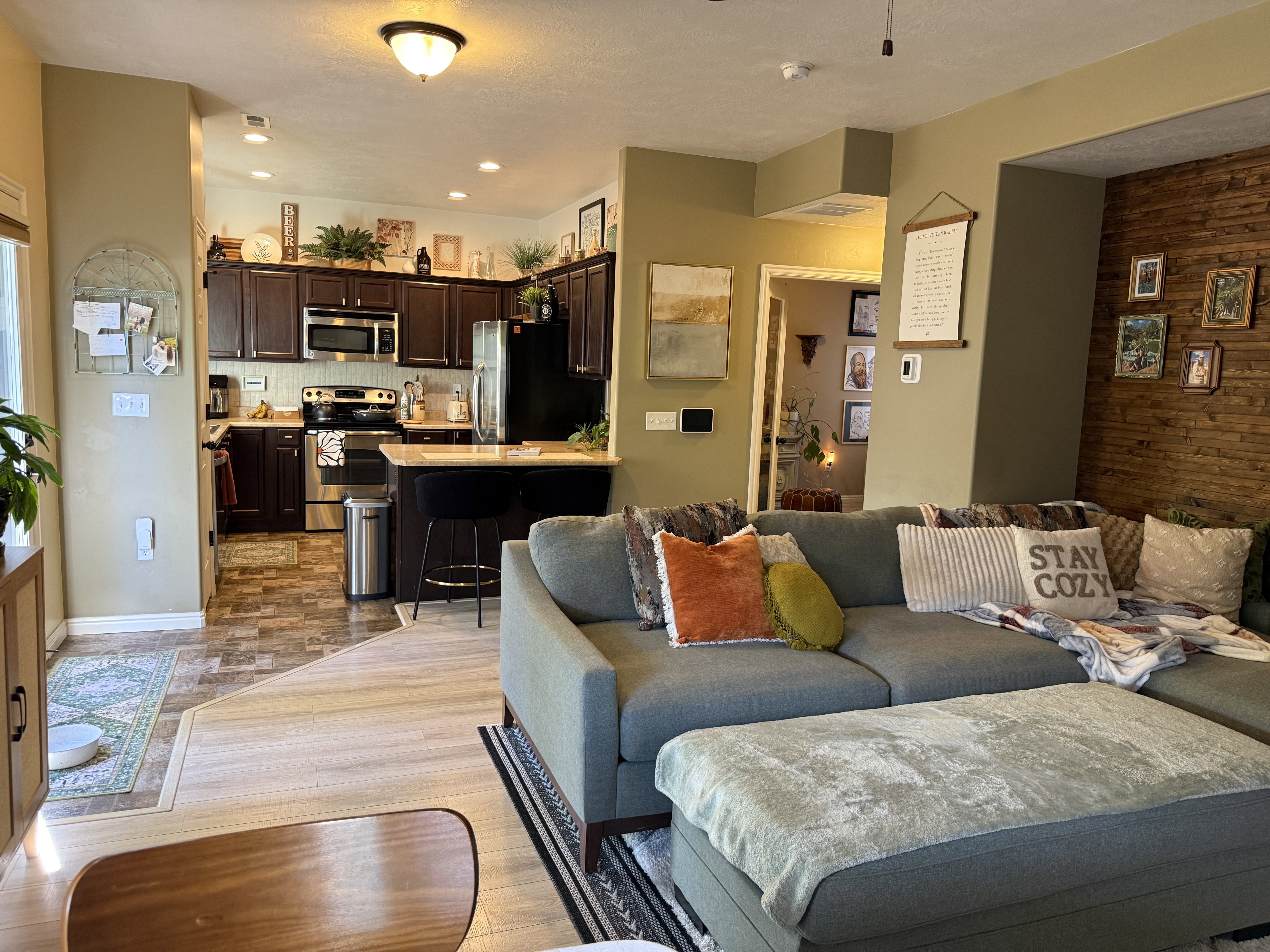 Living area featuring wood walls and light wood-style flooring