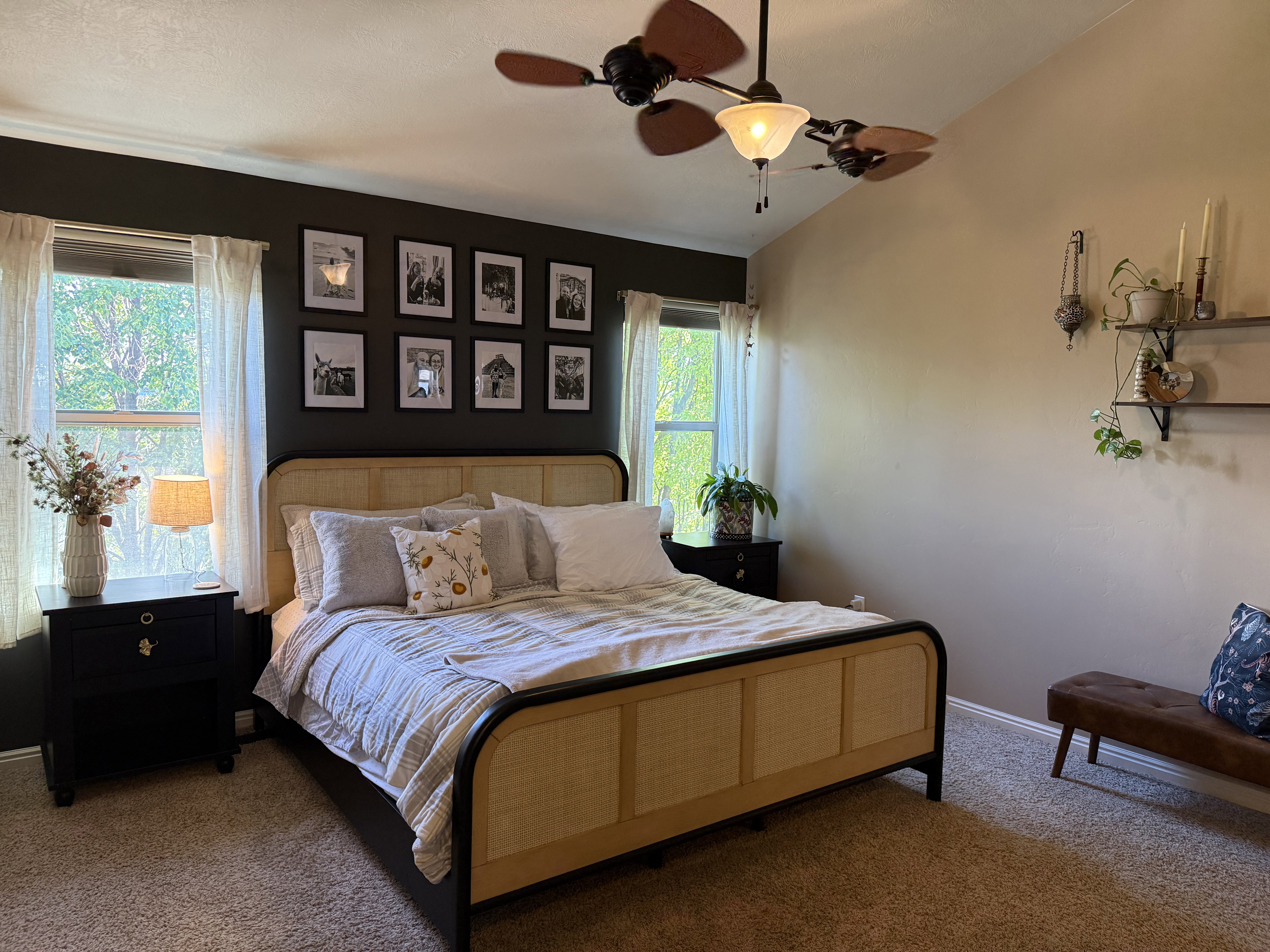 Carpeted bedroom featuring lofted ceiling and ceiling fan