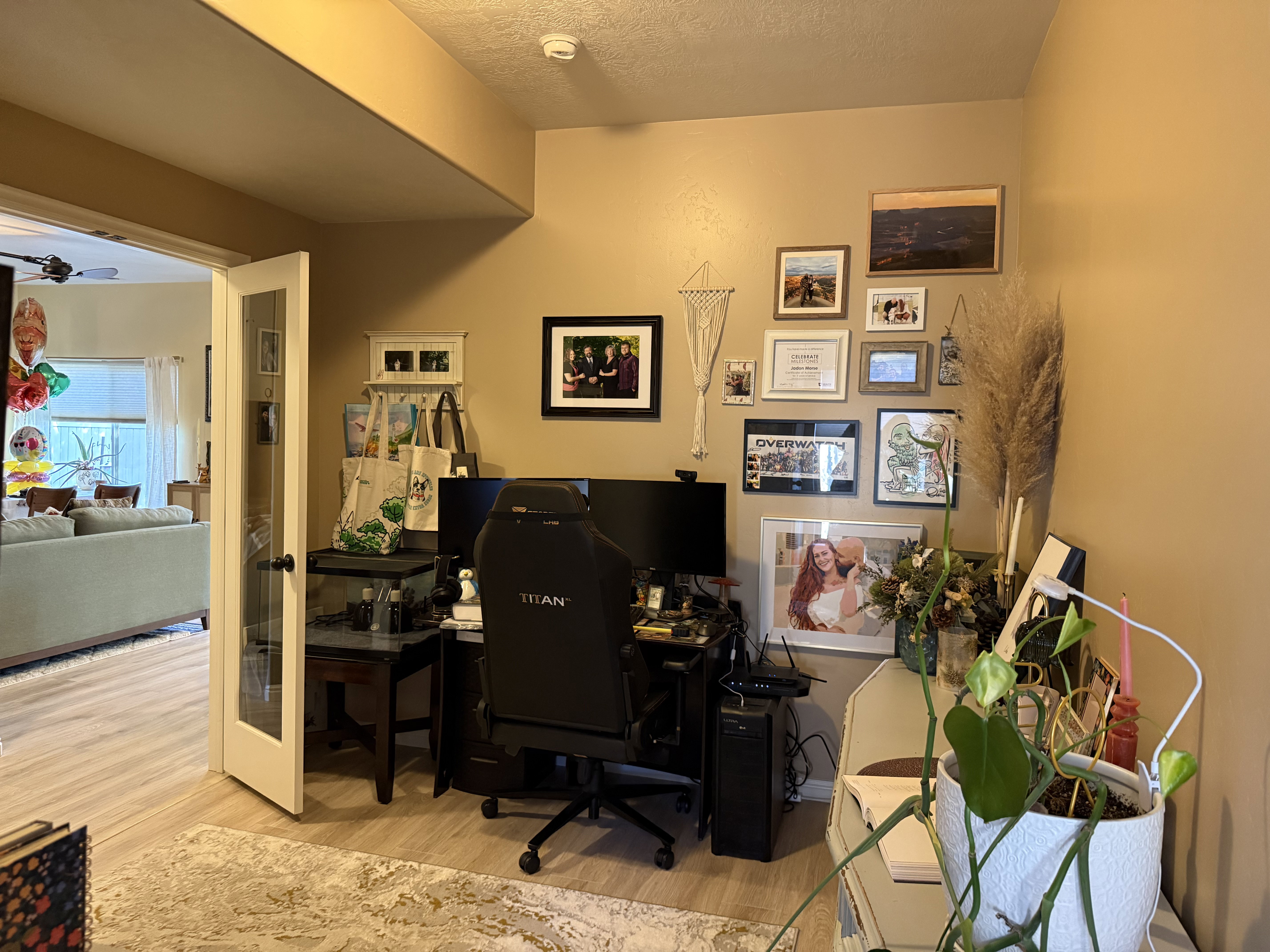 Home office featuring light wood finished floors and a textured ceiling