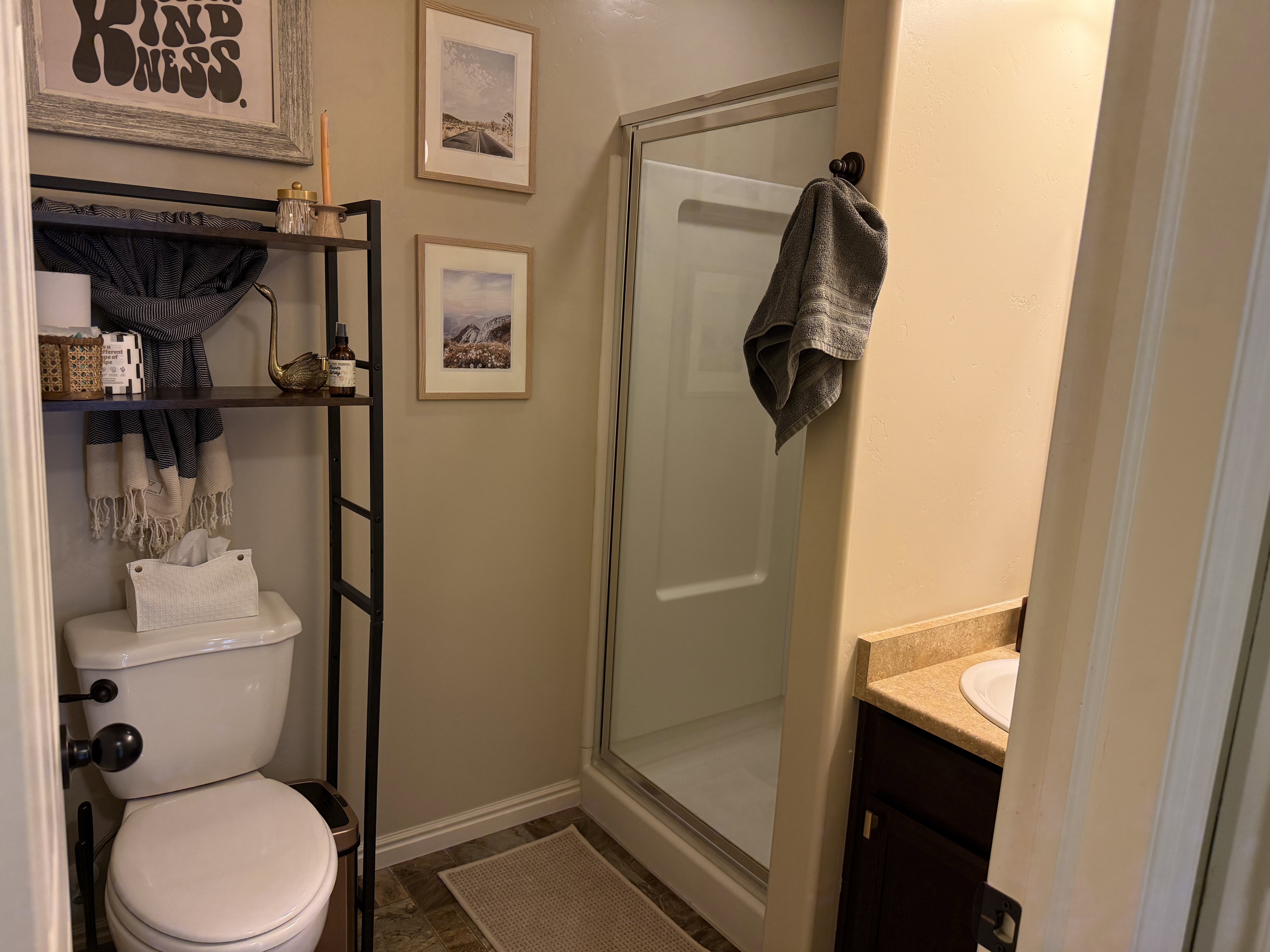 Bathroom with a stall shower and vanity