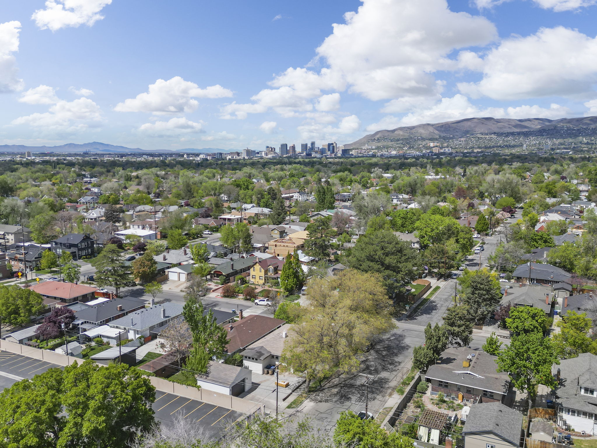 Aerial perspective of suburban area with mountains and skyline