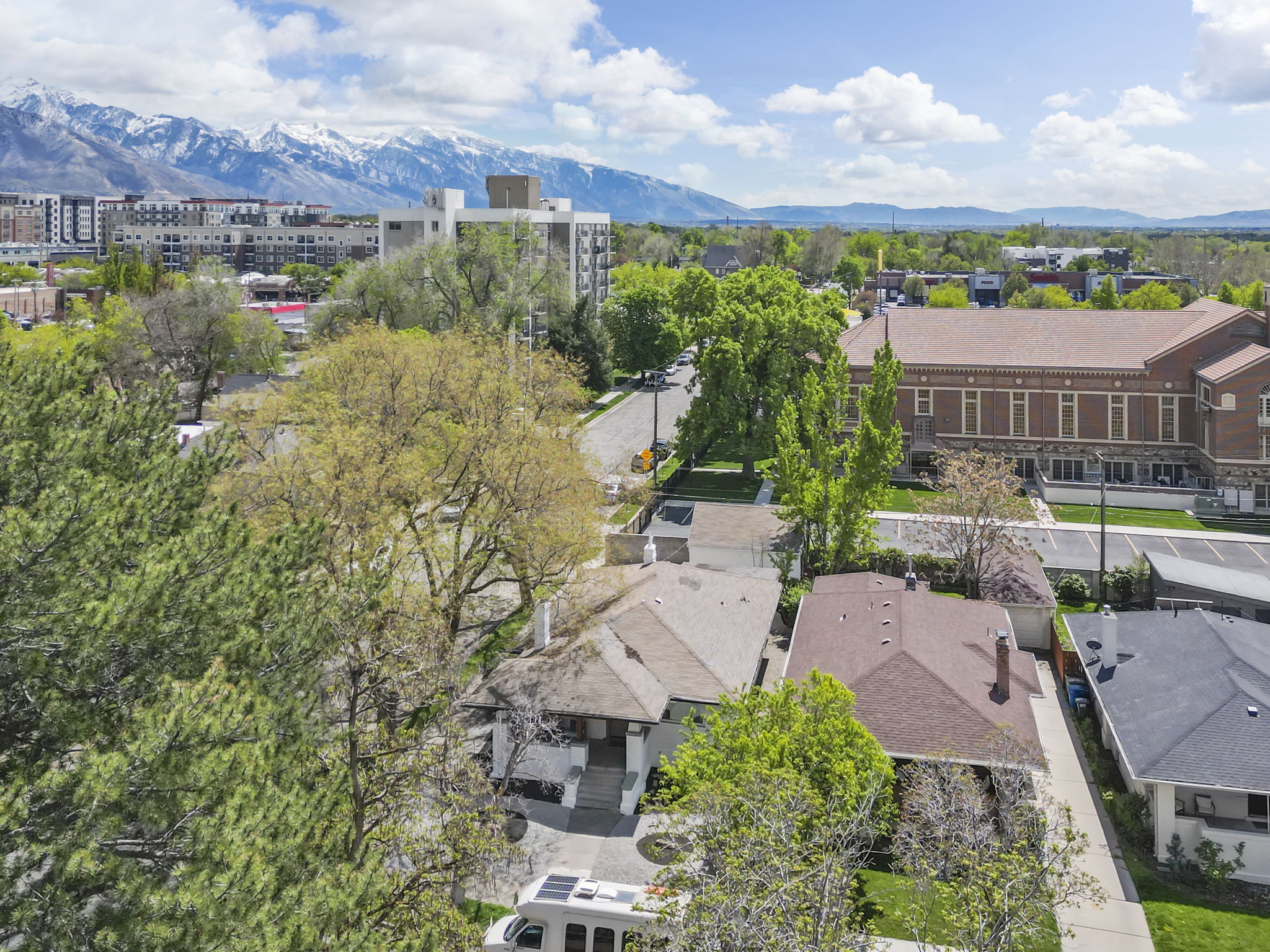 Aerial view of a mountain backdrop and apartment complex / building