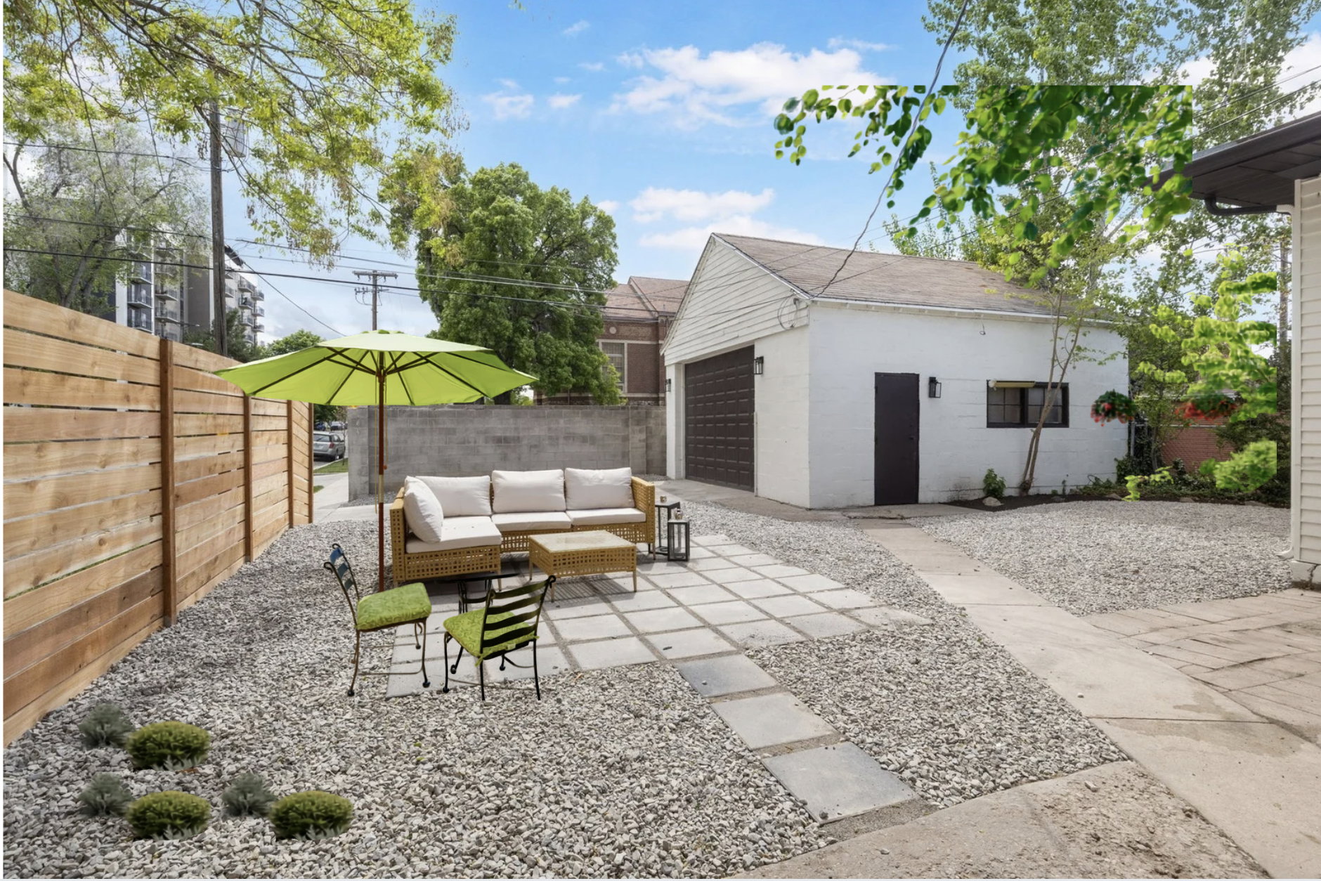 Fenced backyard with outdoor furniture, a patio, and an outbuilding