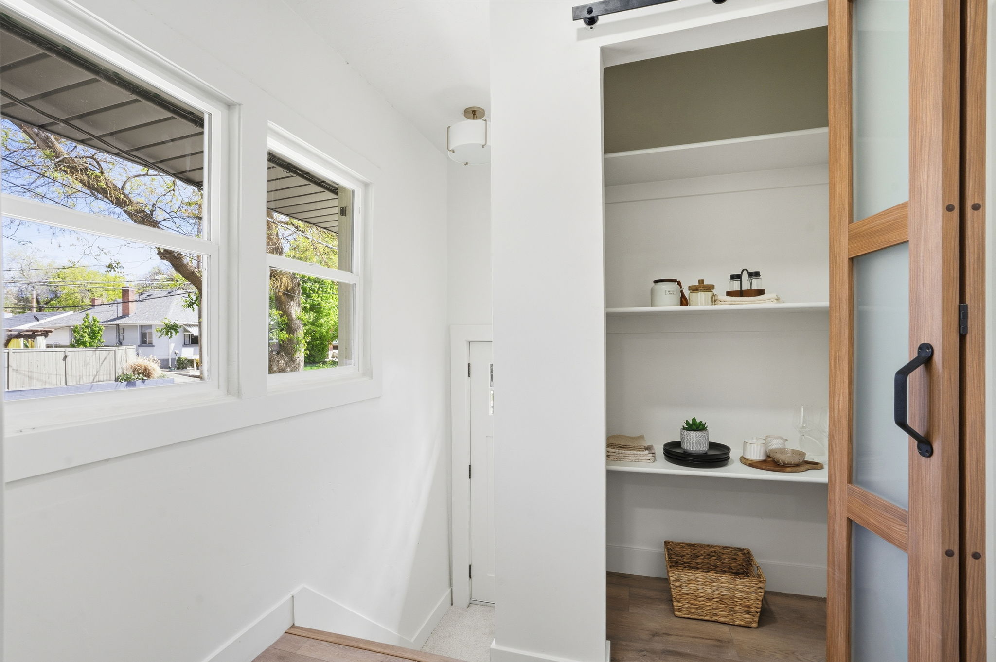 Interior space featuring light wood finished floors and a barn door
