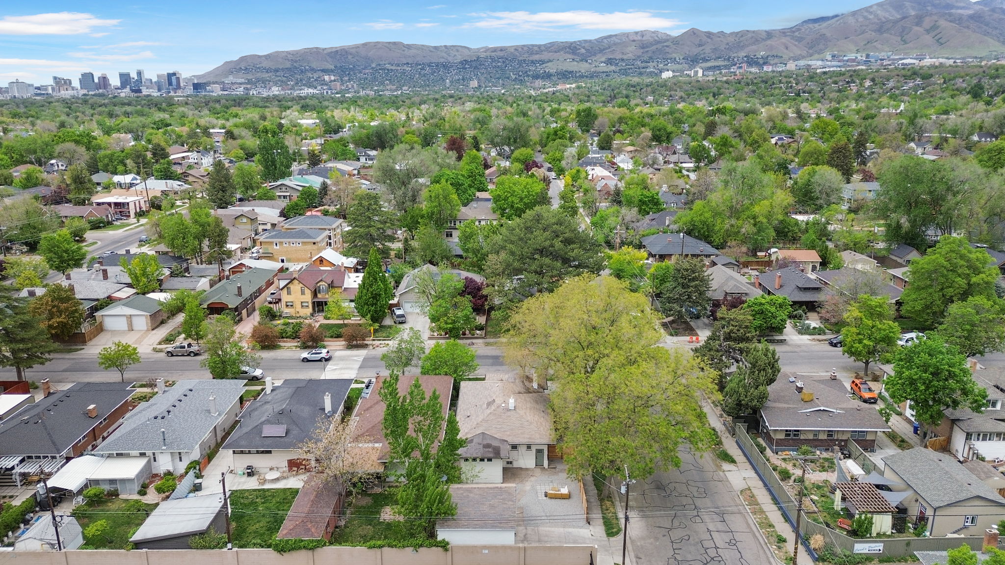 Aerial perspective of suburban area featuring a mountainous background