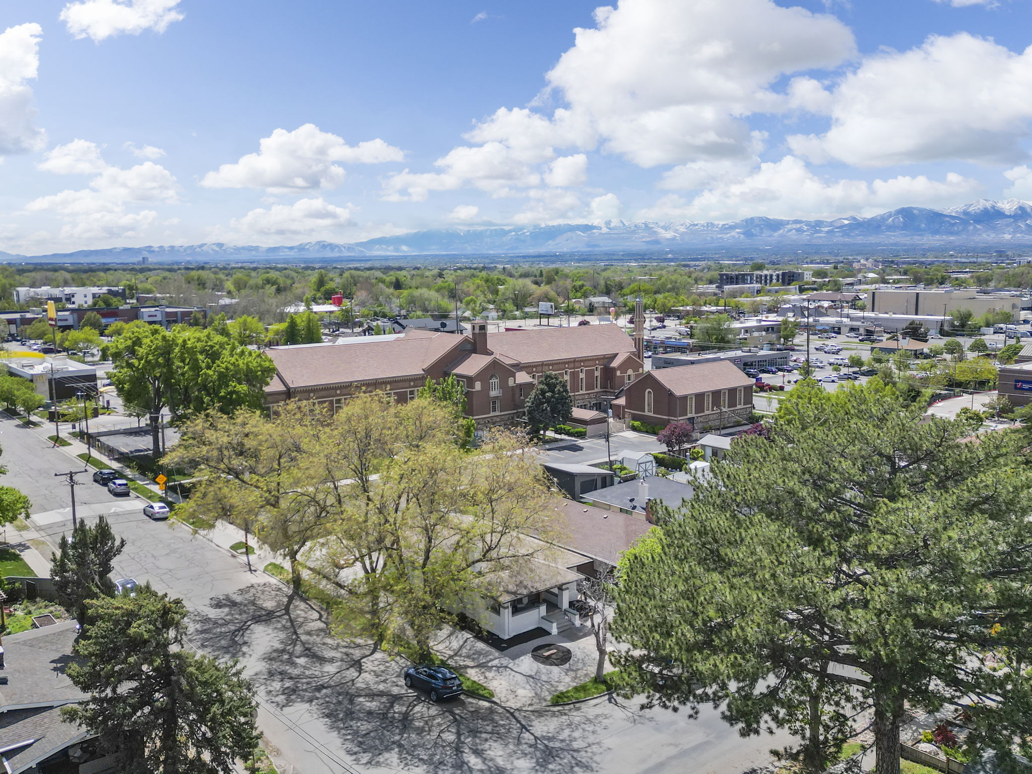 Aerial perspective of suburban area with a mountain backdrop