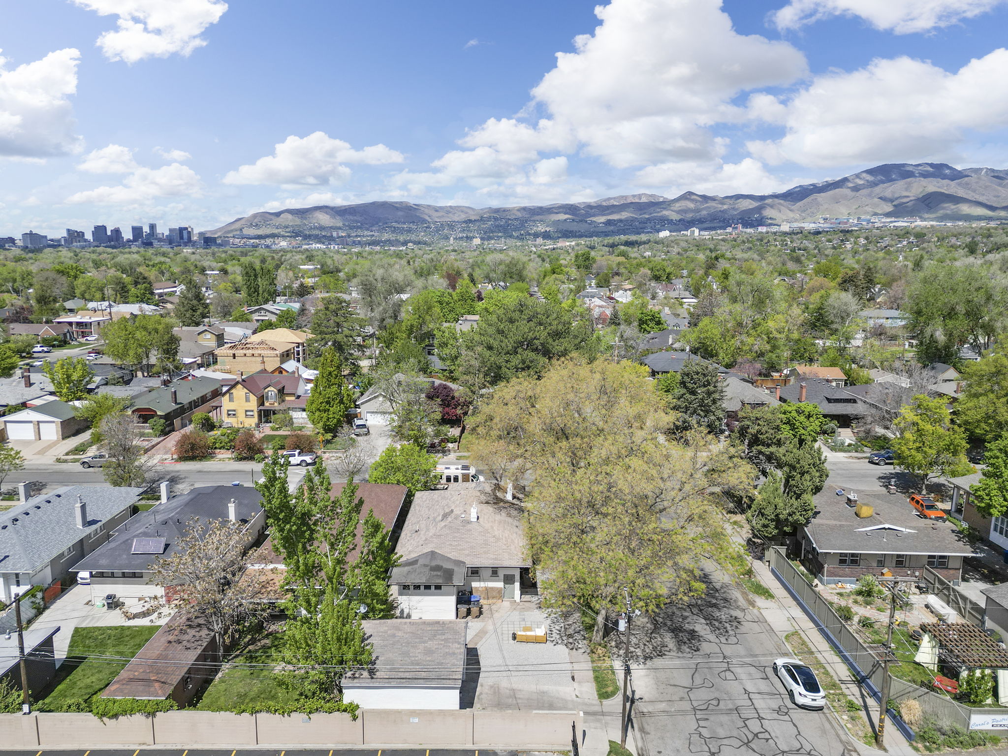 Aerial perspective of suburban area with a mountain backdrop