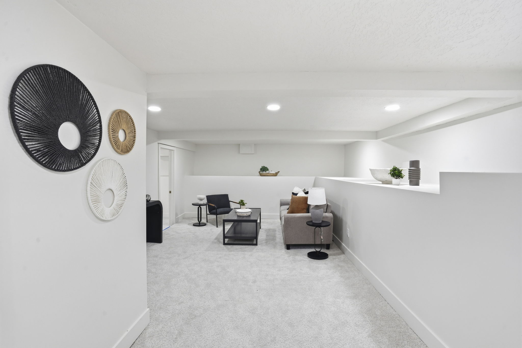 Sitting room featuring light colored carpet and recessed lighting