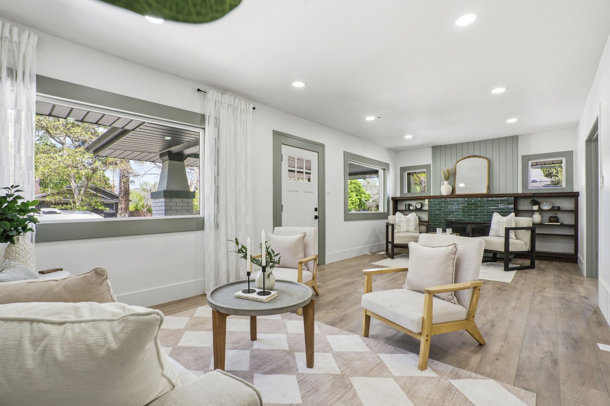 Living area with light wood finished floors, recessed lighting, and a fireplace