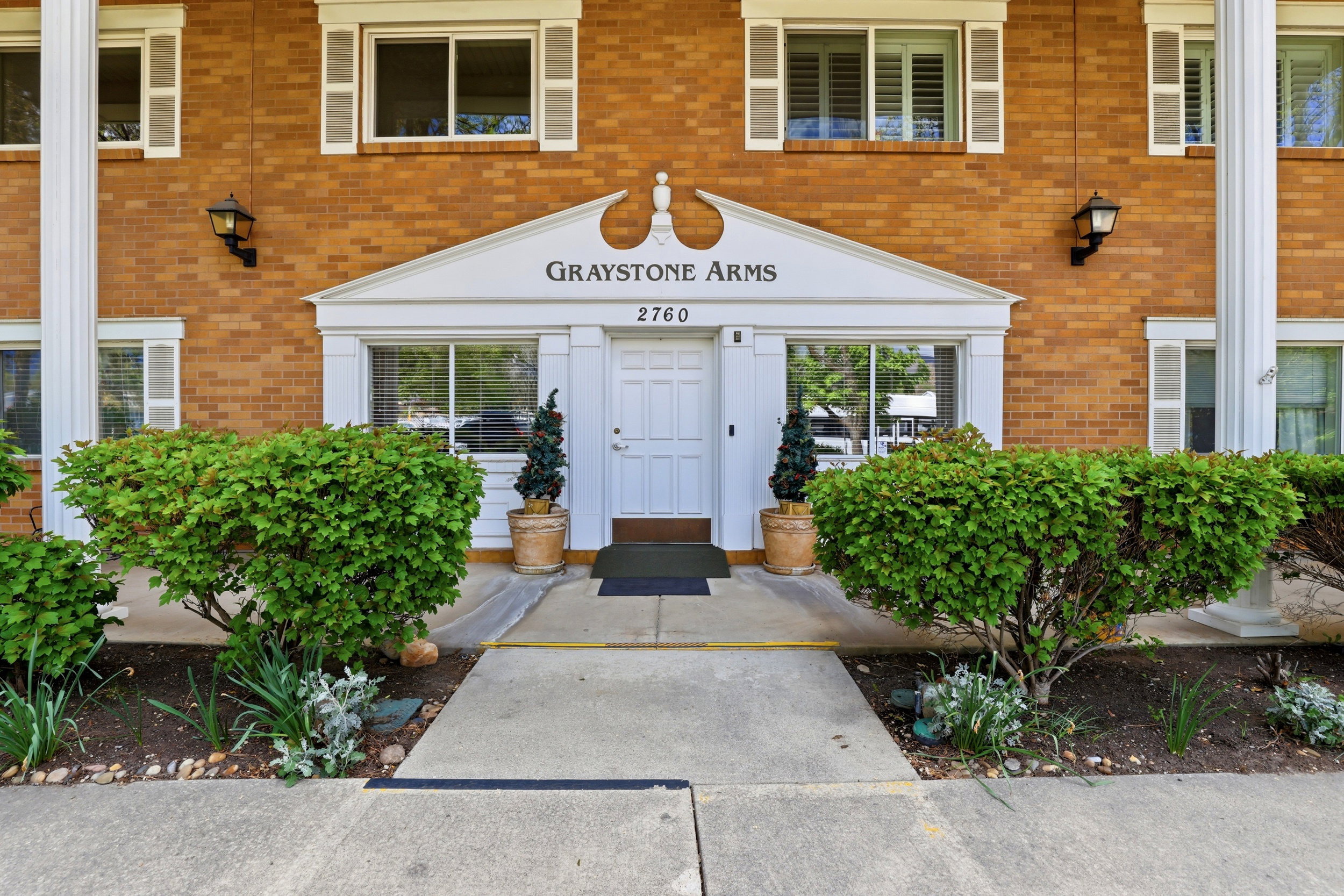 Entrance to property with brick siding