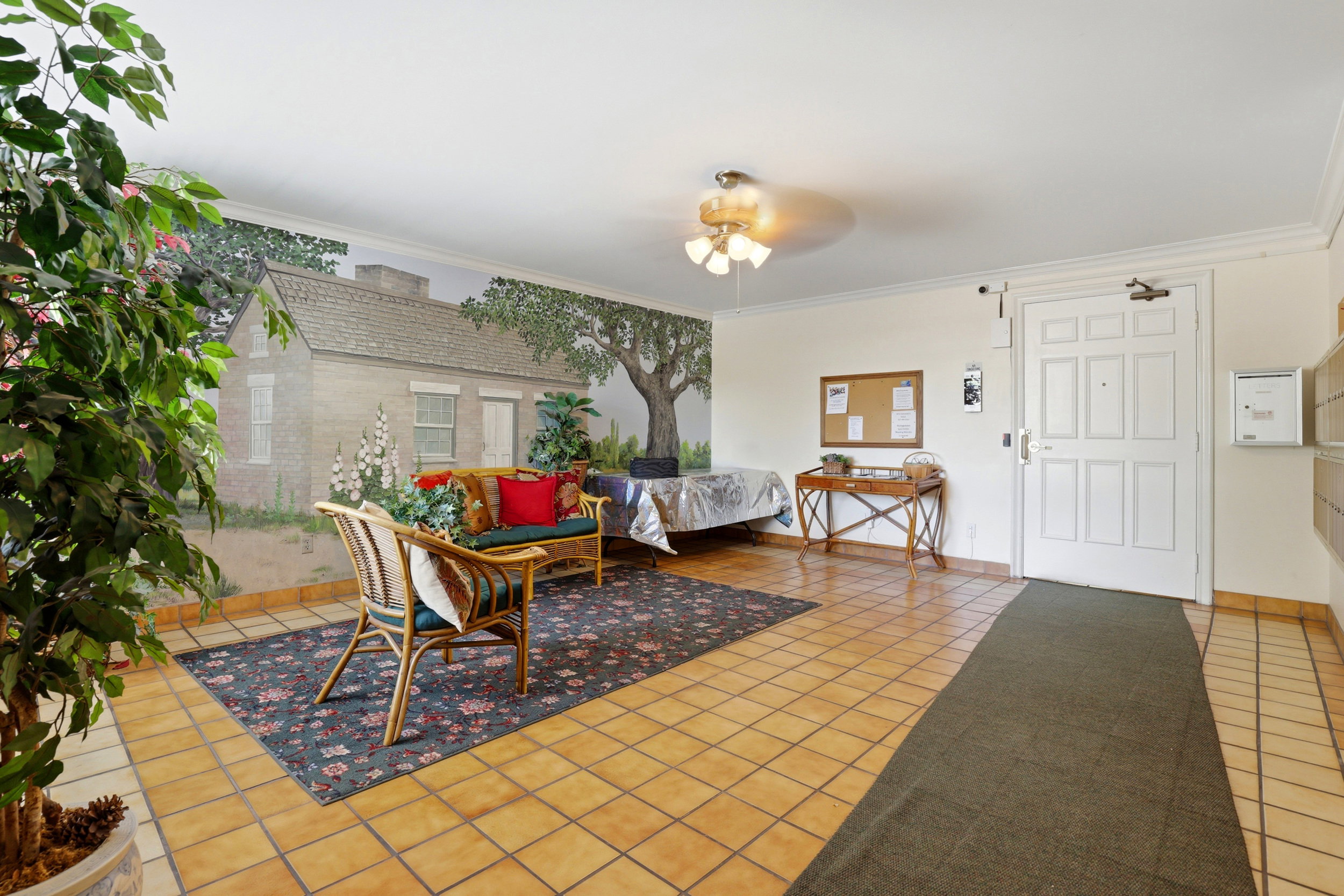 Dining room featuring light tile patterned floors, ceiling fan, and crown molding