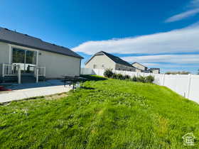 Fenced backyard with a patio