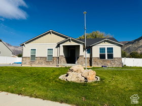 Craftsman-style house featuring stone siding