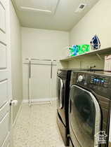 Laundry room with washing machine and dryer and baseboards