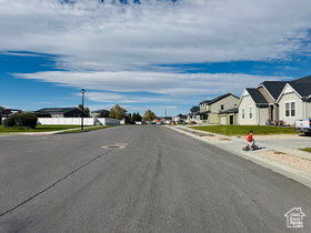 North View of street with a residential view, sidewalks, and curbs