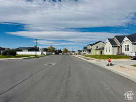 North View of street with a residential view, sidewalks, and curbs