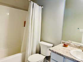 Main Bathroom featuring vanity and shower / bath combo with shower curtain