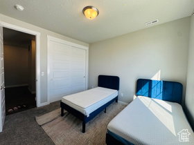 Third Bedroom Carpeted bedroom with a closet