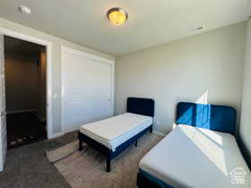 Third Bedroom Carpeted bedroom with a closet