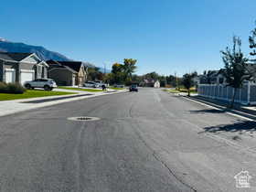 South View of road featuring sidewalks, a residential view, and curbs