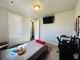 Bedroom TWO Carpeted bedroom with baseboards and a closet