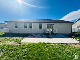 Rear view of house with a patio area