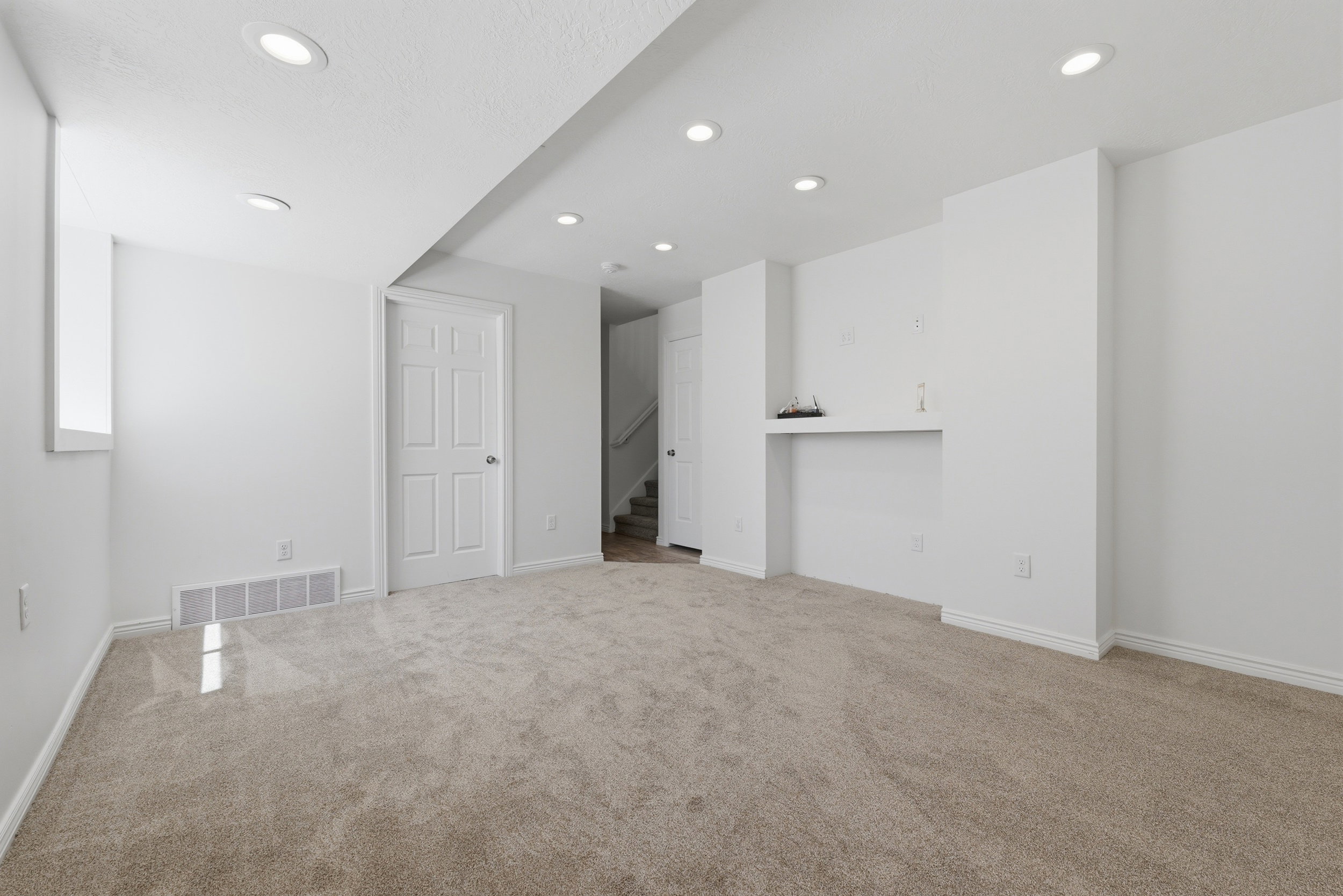 Carpeted 2ND LIVING living space featuring recessed lighting, a built-in media niche, and a neutral color palette