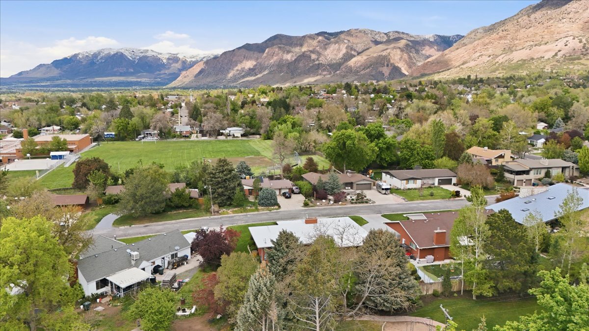 Aerial perspective of suburban area with a mountainous background