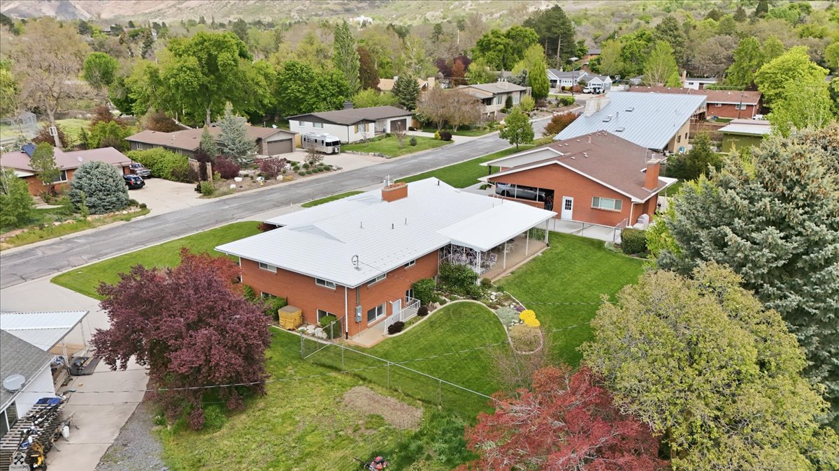 Aerial view of residential area with a tree filled landscape
