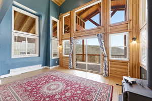Interior space with lofted ceiling and baseboard heating