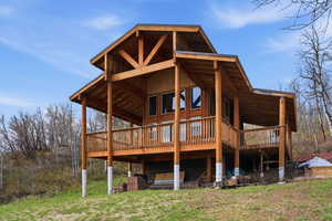 Back of house featuring a deck