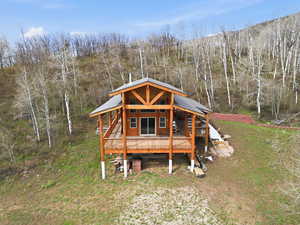 View of outbuilding featuring a forest view