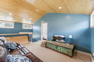 Carpeted bedroom featuring recessed lighting and wooden ceiling