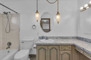 Bathroom featuring vanity and bathtub / shower combination