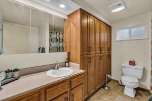 Bathroom with vanity and curtained shower