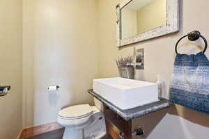 Bathroom with vanity and wood finished floors