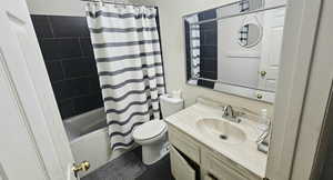 Bathroom featuring vanity and shower / tub combo