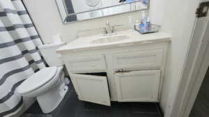 Bathroom featuring vanity and a shower with curtain