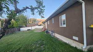 Fenced backyard featuring a mountain view