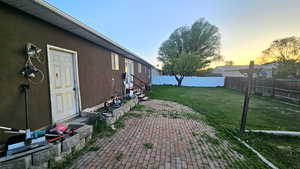 Fenced backyard with entry steps