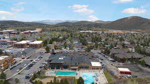 Aerial view of a mountain backdrop and a pool area