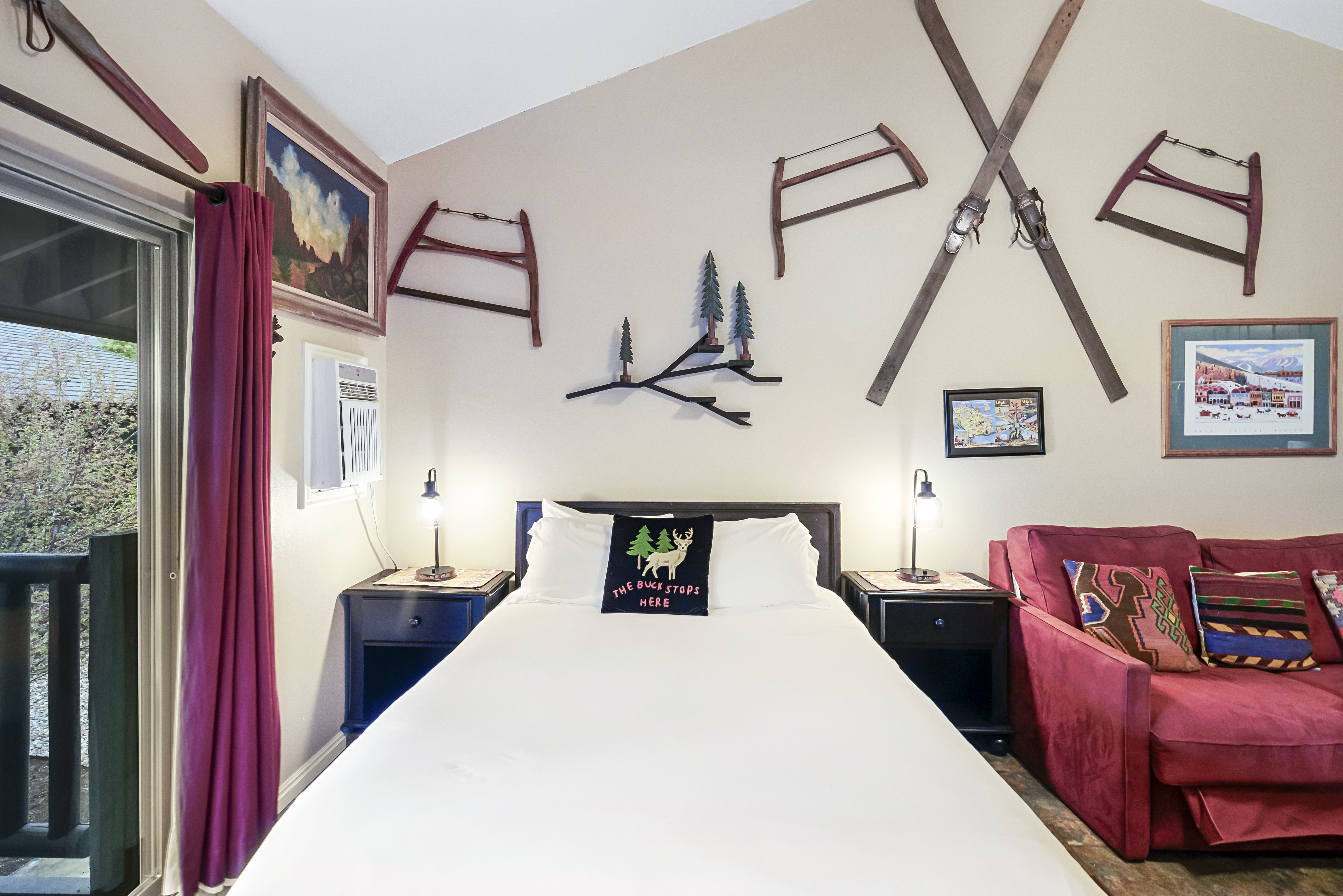 Bedroom featuring a wall mounted air conditioner and access to outside