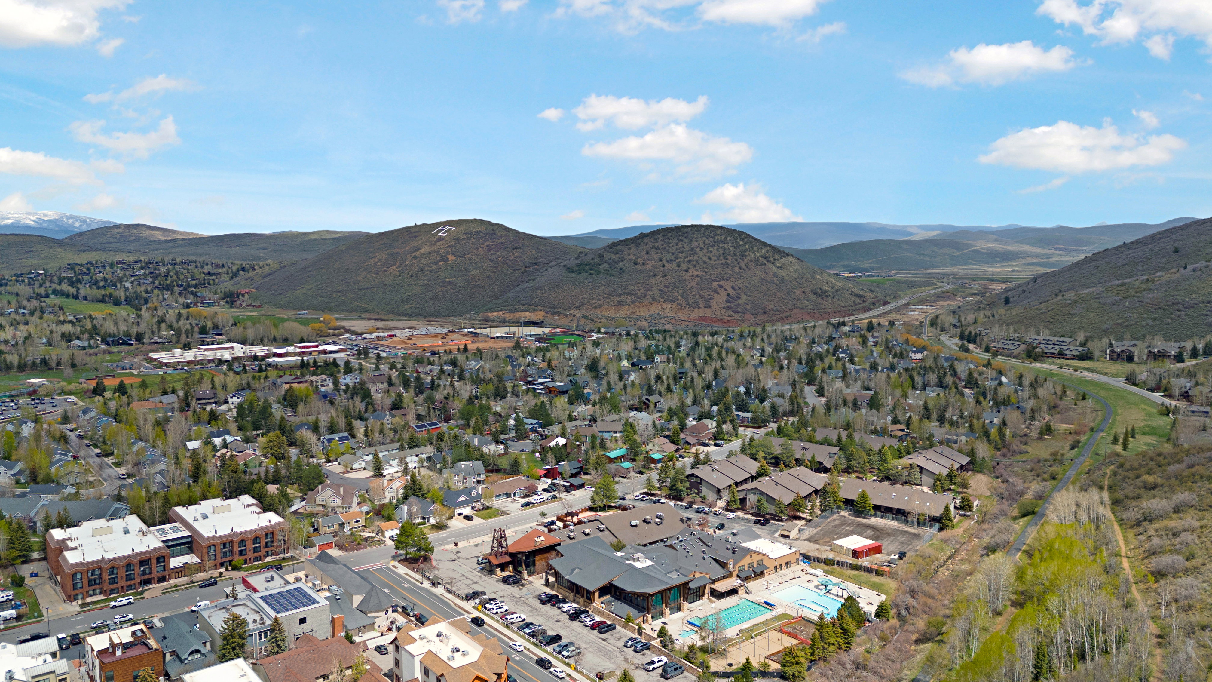 Aerial view of a mountainous background and a pool