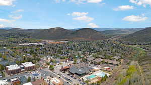 Aerial view of a mountainous background and a pool