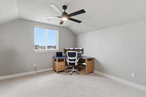 Office area featuring light colored carpet and ceiling fan