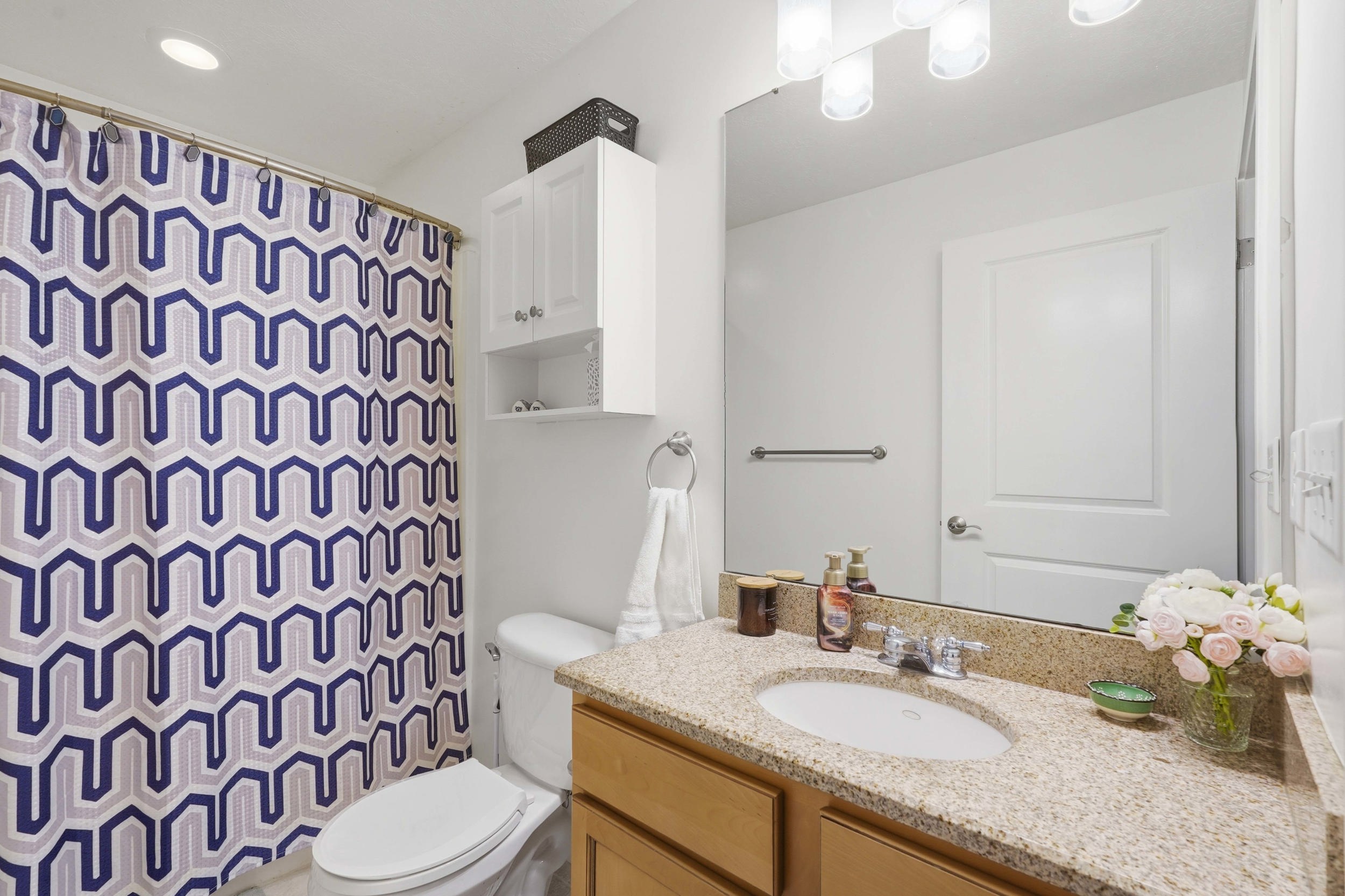 Bathroom featuring vanity and a shower with curtain