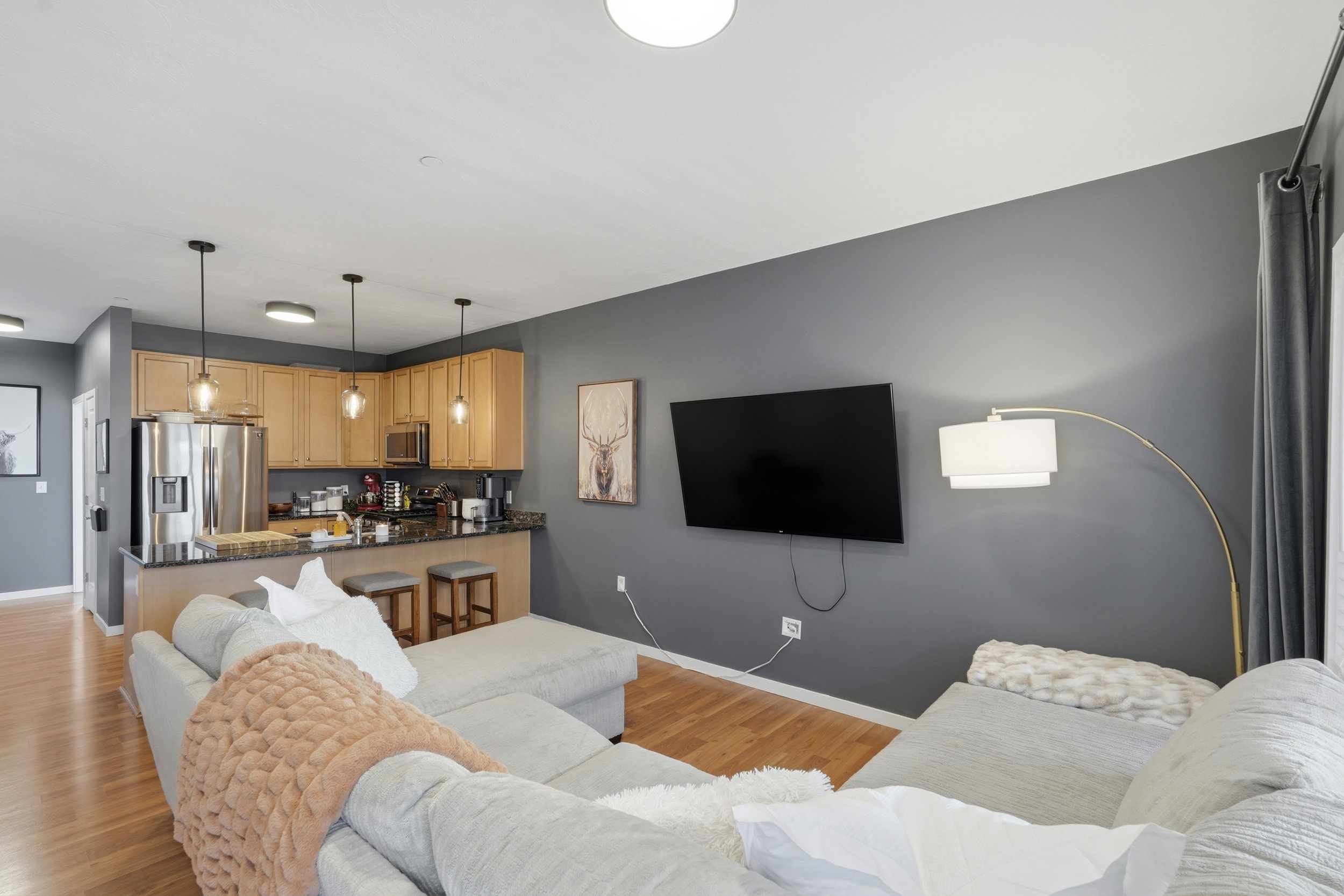 Living area featuring light wood-type flooring and baseboards
