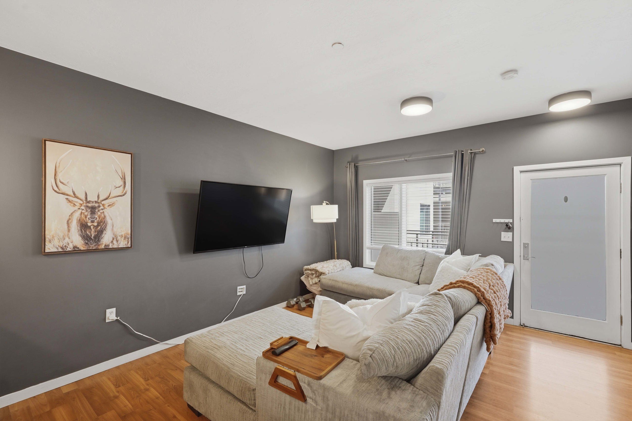 Living room with wood finished floors and baseboards