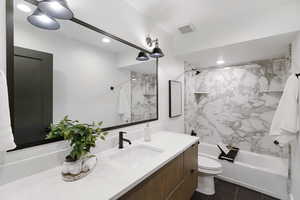 Bathroom with Quartz. Raised Vanity,  Large Framed Mirror