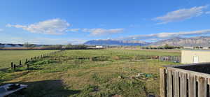 View of mountain backdrop featuring rural landscape